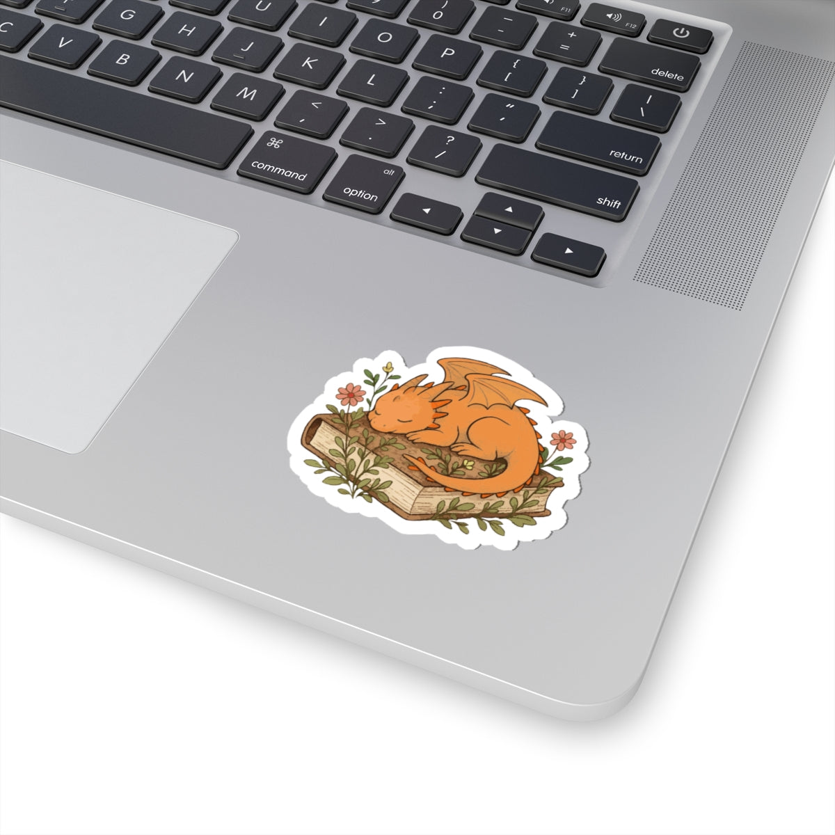 Sleeping Dragon Sticker — Cute Orange Dragon Napping on Book, Cozy Fantasy Laptop Decals