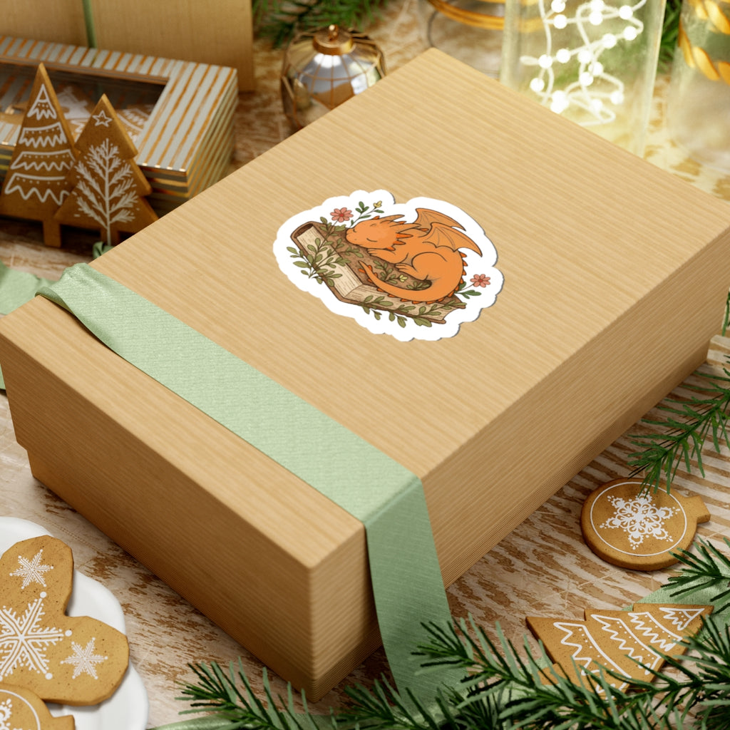Sleeping Dragon Sticker — Cute Orange Dragon Napping on Book, Cozy Fantasy Laptop Decals