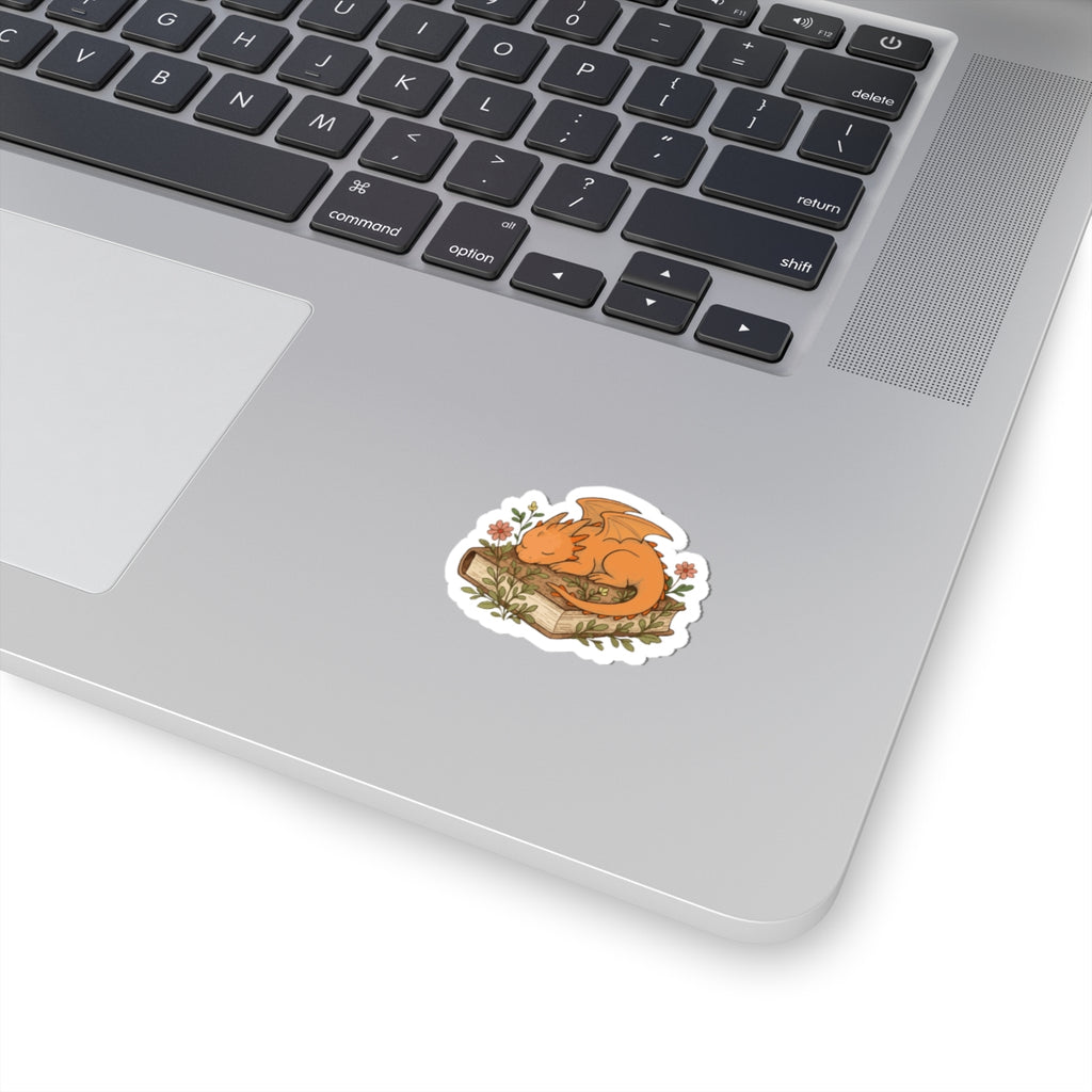 Sleeping Dragon Sticker — Cute Orange Dragon Napping on Book, Cozy Fantasy Laptop Decals