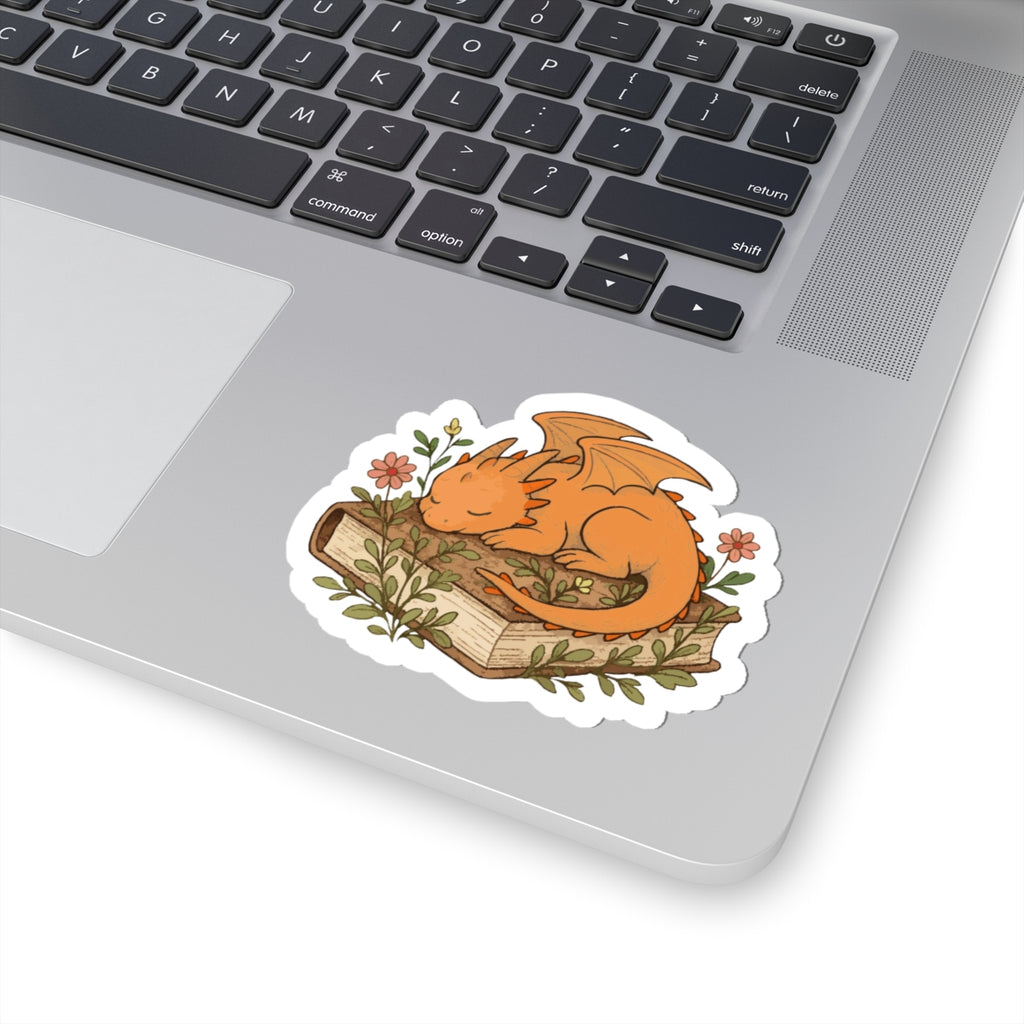 Sleeping Dragon Sticker — Cute Orange Dragon Napping on Book, Cozy Fantasy Laptop Decals