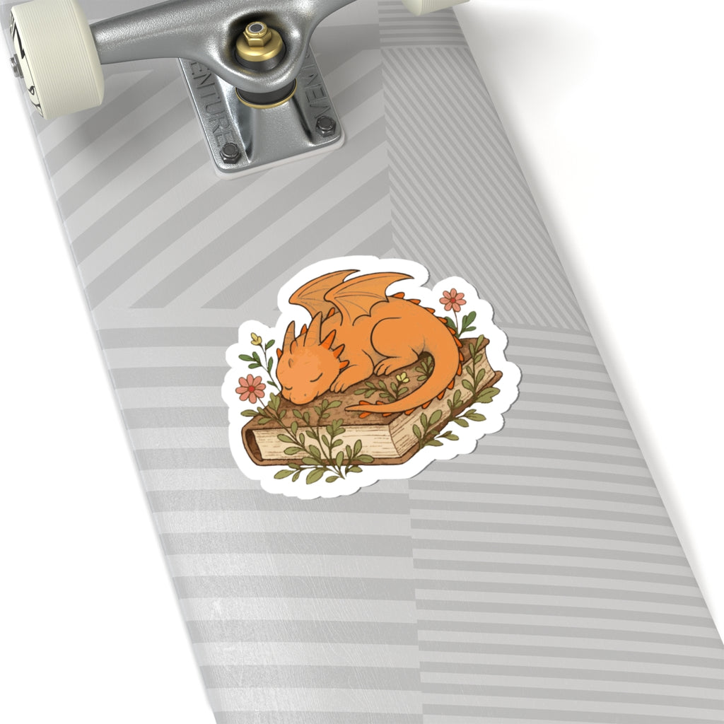 Sleeping Dragon Sticker — Cute Orange Dragon Napping on Book, Cozy Fantasy Laptop Decals